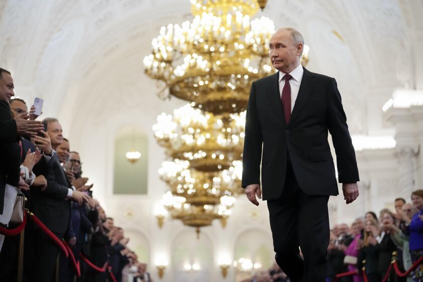 FILE - Vladimir Putin walks to his presidential inauguration in the Grand Kremlin Palace in Moscow, Russia, on May 7, 2024. Putin is traveling to China on Thursday on his first foreign trip as he starts his fifth term, a visit that underscores an increasingly close partnership between Moscow and Beijing. (AP Photo/Alexander Zemlianichenko, Pool, File)