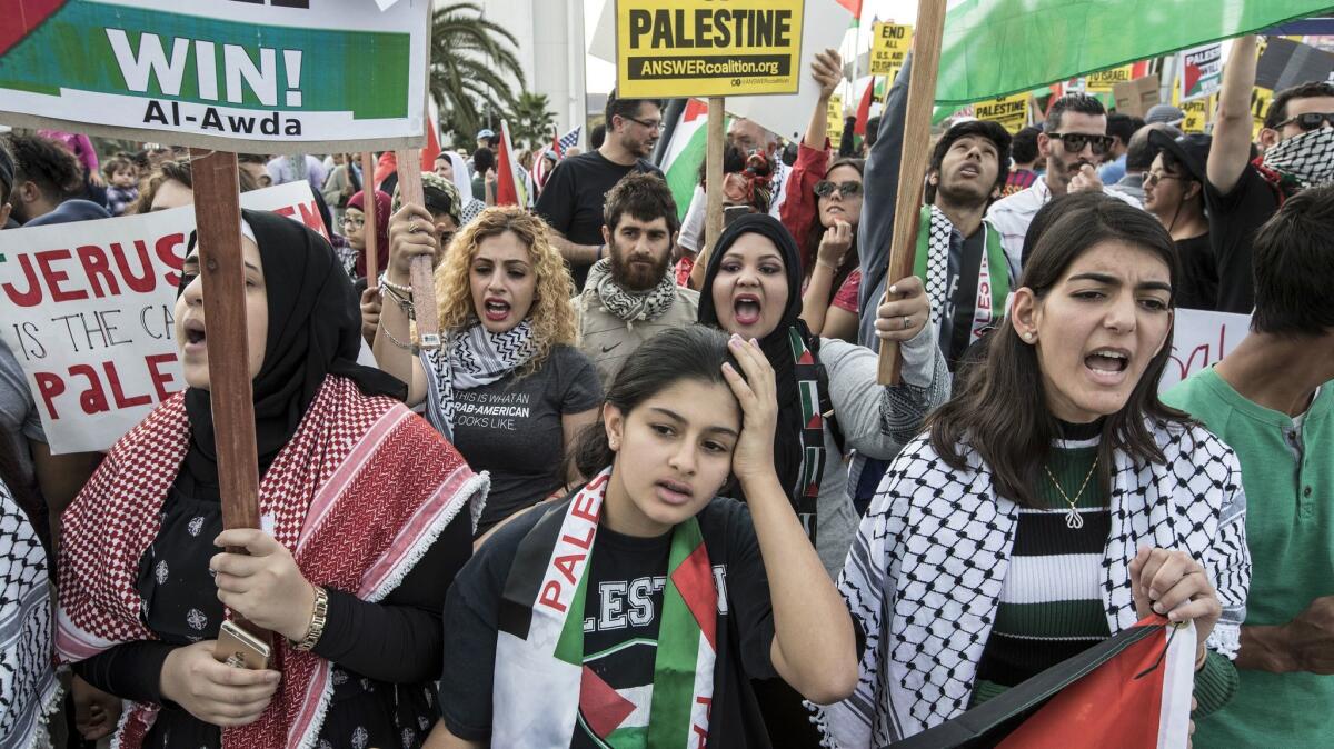 Palestinian rights activists rally in L.A. on Sunday against President Trump’s recognition of Jerusalem as the capital of Israel; a smaller group of counter-protesters hailed the move.