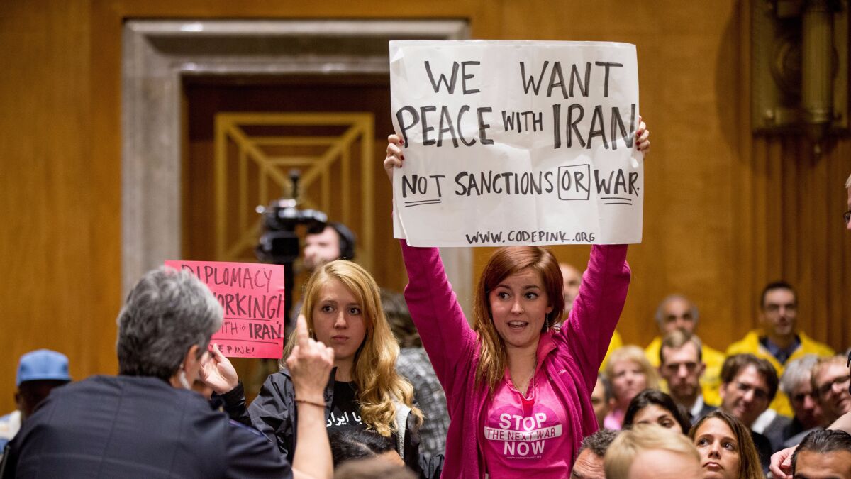 Protesters attend a Senate Foreign Relations Committee business meeting on Capitol Hill in Washington to debate and vote on the Iran Nuclear Agreement Review Act of 2015 last year.