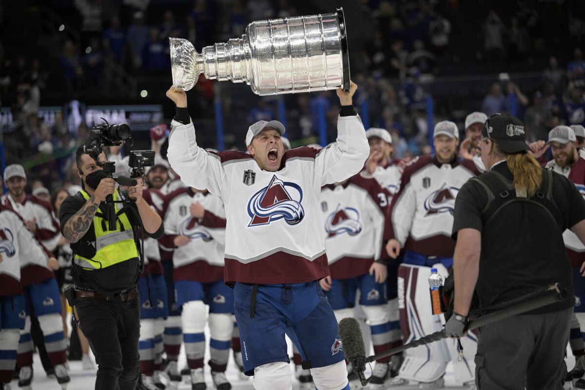 Colorado defenseman Jack Johnson skates with the Stanley Cup.