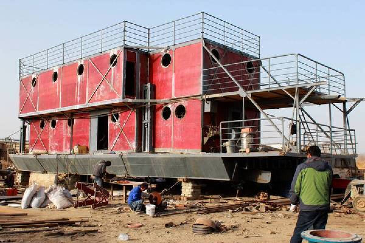 Doomsday fears drove one man in Urumqi, China, to build a boat to provide his family refuge in the event of a massive flood.