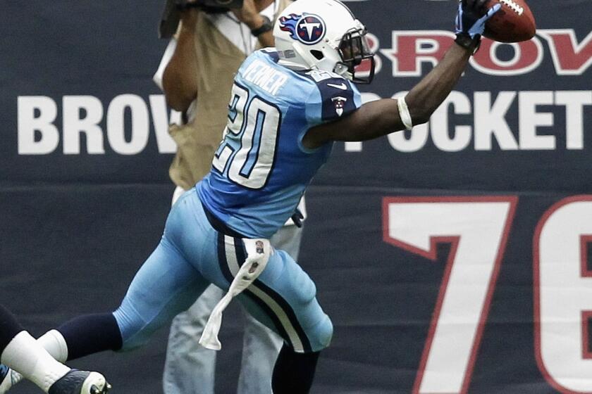 Tennessee cornerback Alterraun Verner celebrates after scoring on an interception return against the Houston Texans last month. Verner has been a problem solver for the Titans' defense.