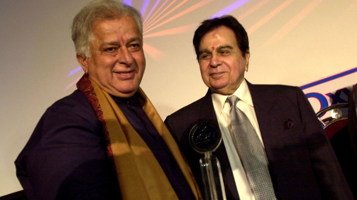 Shashi Kapoor, left, appears with fellow Bollywood actor Dilip Kumar in 2005 at a premiere in Mumbai.