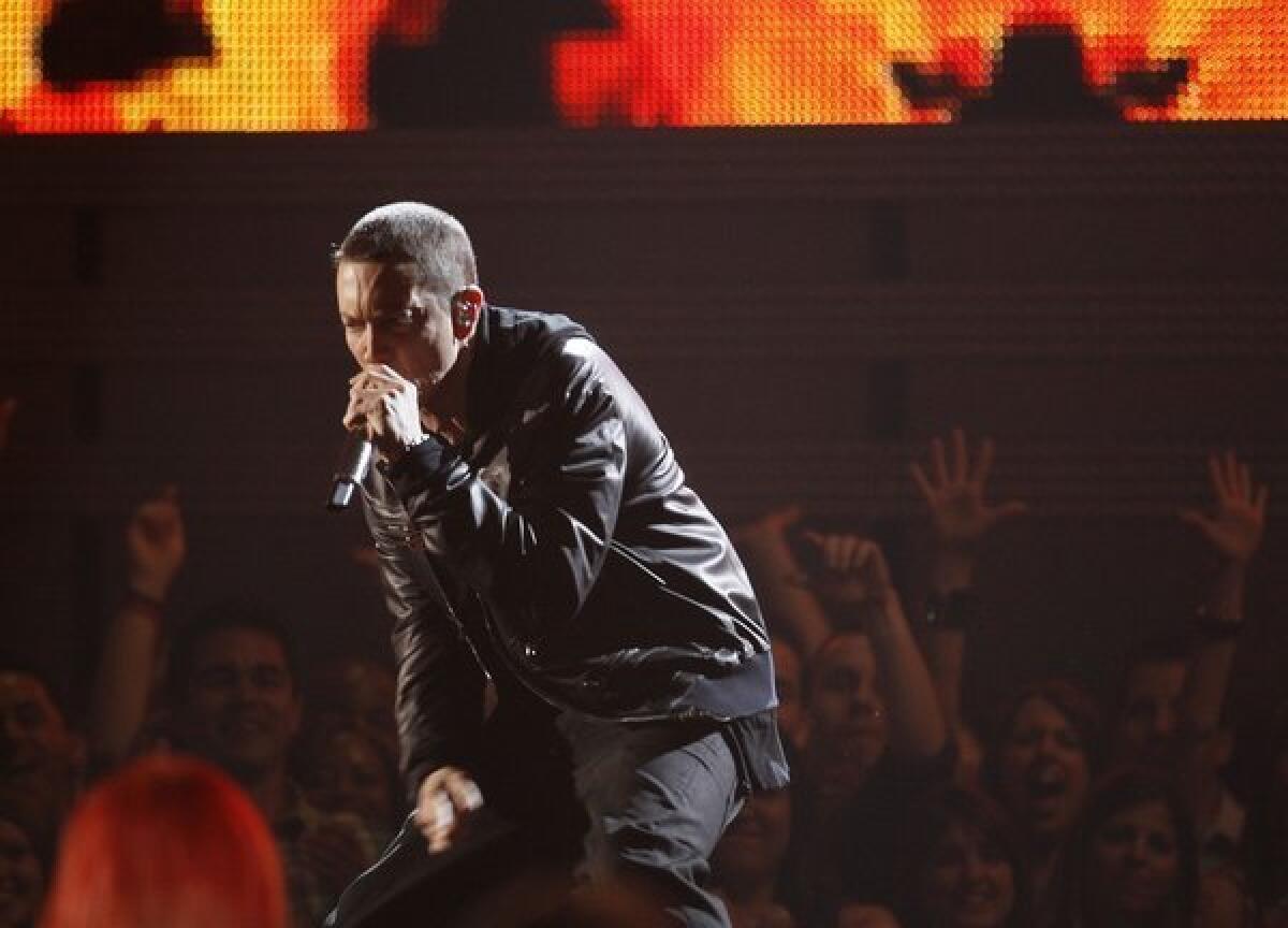 Rapper Eminem, shown performing during the 2011 Grammy Awards show, is expected to release his eighth album sometime after Memorial Day.