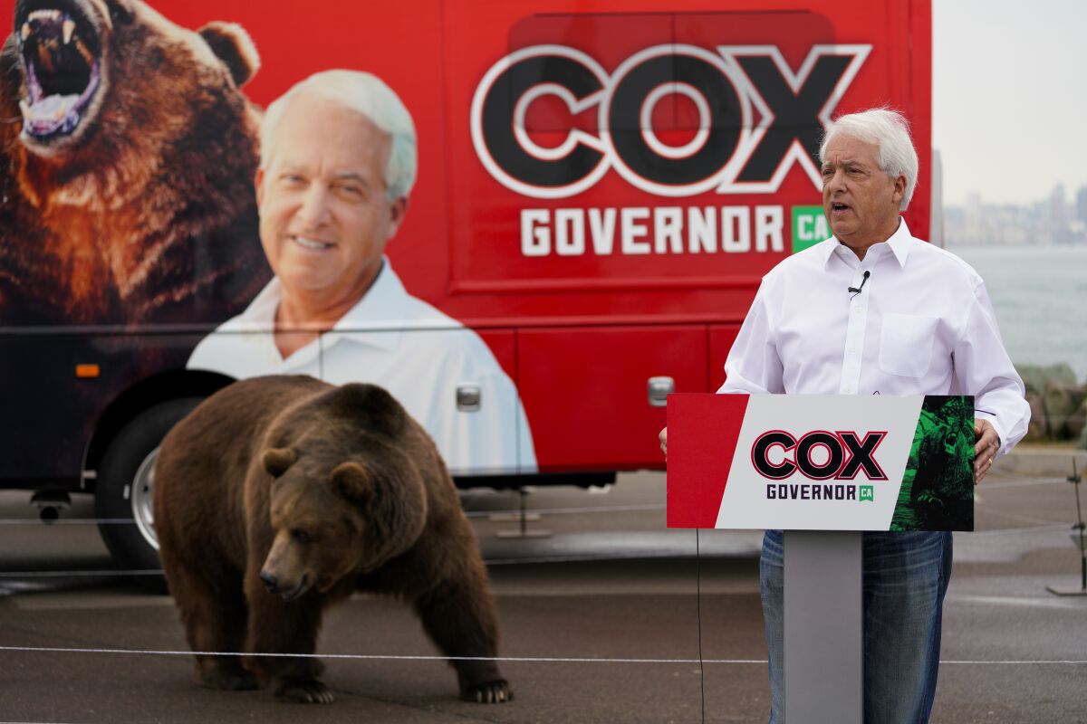 John Cox campaigns with bear.
