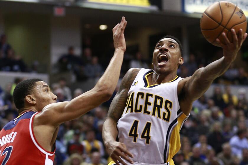 Indiana Pacers guard Jeff Teague (44) shoots the basketball defended by Washington Wizards forward Otto Porter Jr. in the second half on Monday.