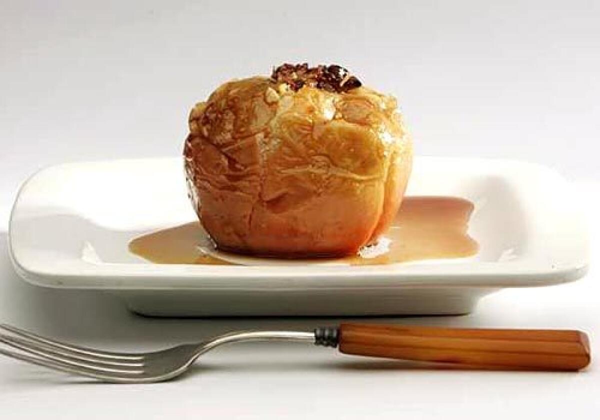 A baked apple is served whole.