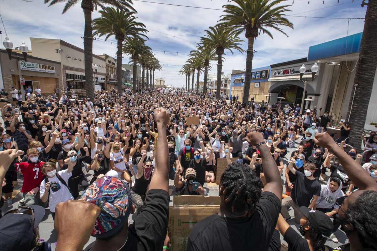 Several hundred Black Lives Matter protesters take a knee