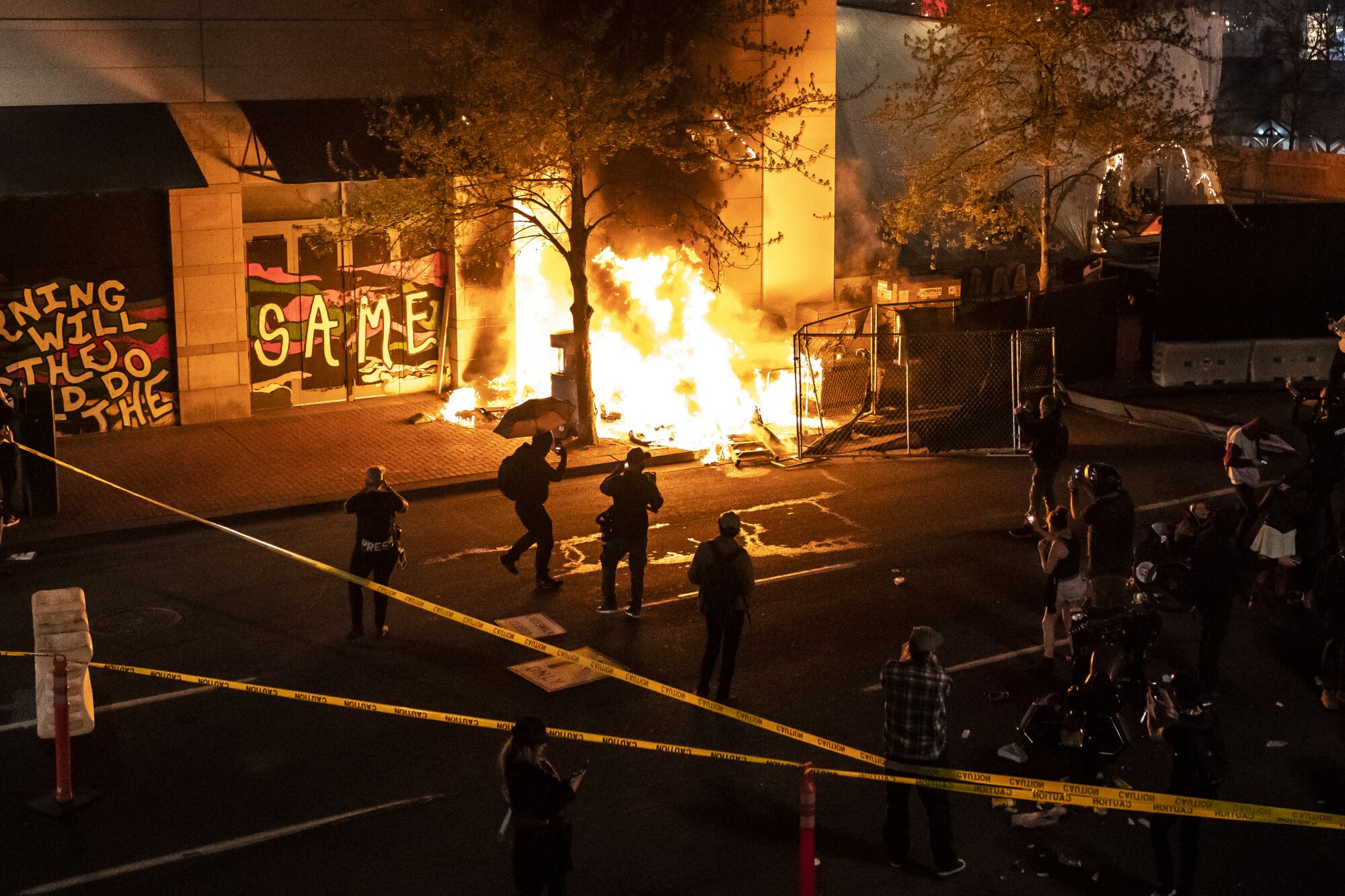 A fire on the sidewalk during protests in Portland