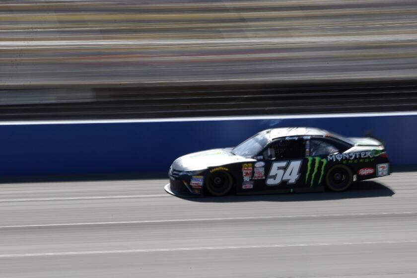 NASCAR's Denny Hamlin in the Monster Energy car at Auto Club Speedway in Fontana on March 21. The energy drink maker is a big sponsor in motorsports.