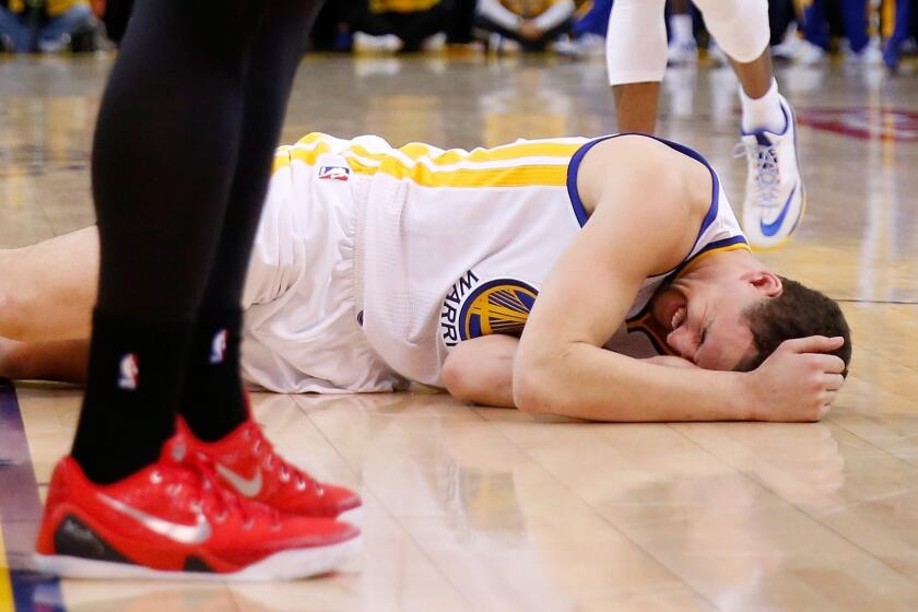 Golden State's Klay Thompson is injured during the fourth quarter against the Houston Rockets on Wednesday night.