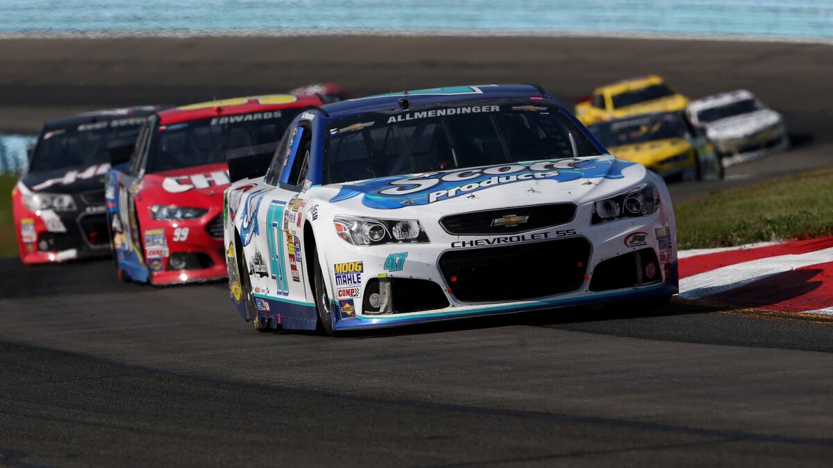 A.J. Allmendinger leads a pack of cars during Sunday's NASCAR Sprint Cup race at Watkins Glen International.