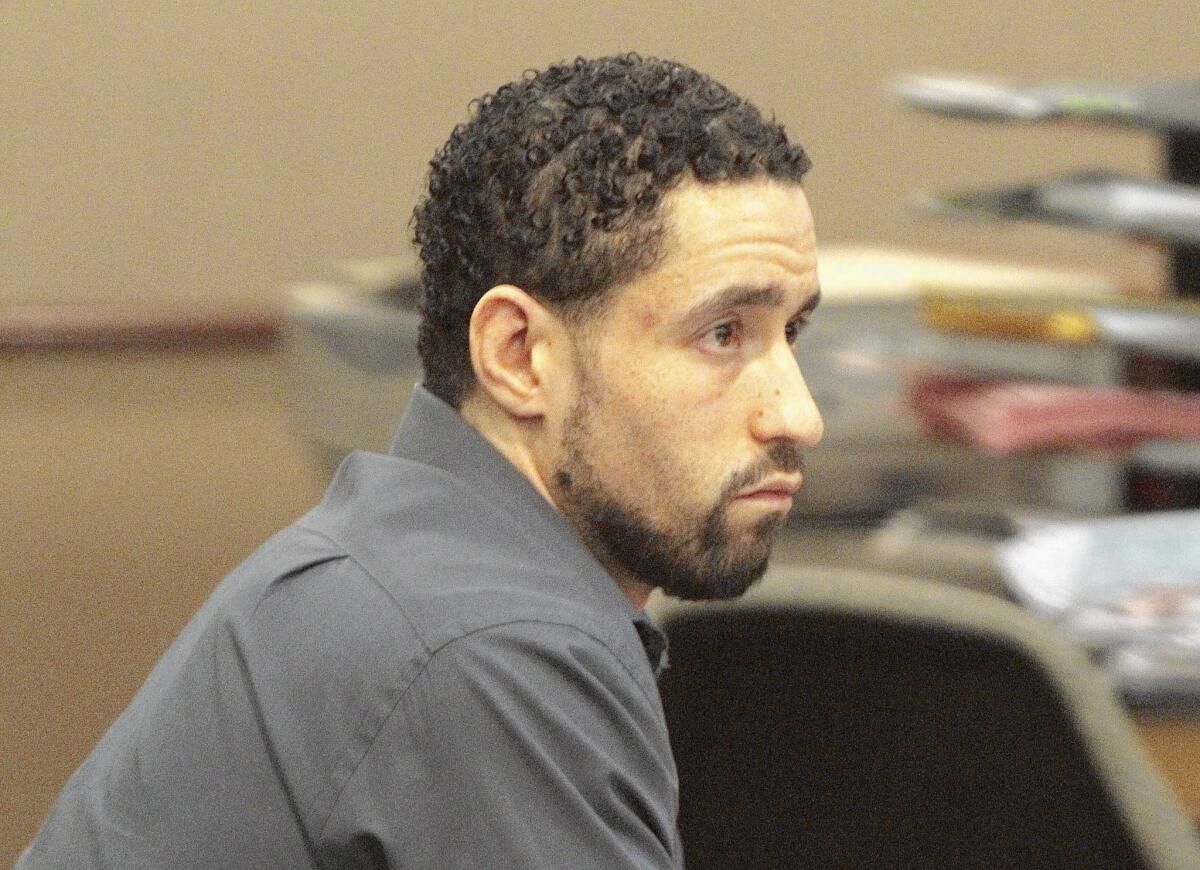 Alex Jackson, 31, shown in a Lancaster courtroom on Aug. 20, has been found guilty of second-degree murder in the May 2013 mauling death of Pamela Devitt, 63, who was attacked by four of Jackson's pit bulls in the Antelope Valley town of Littlerock.