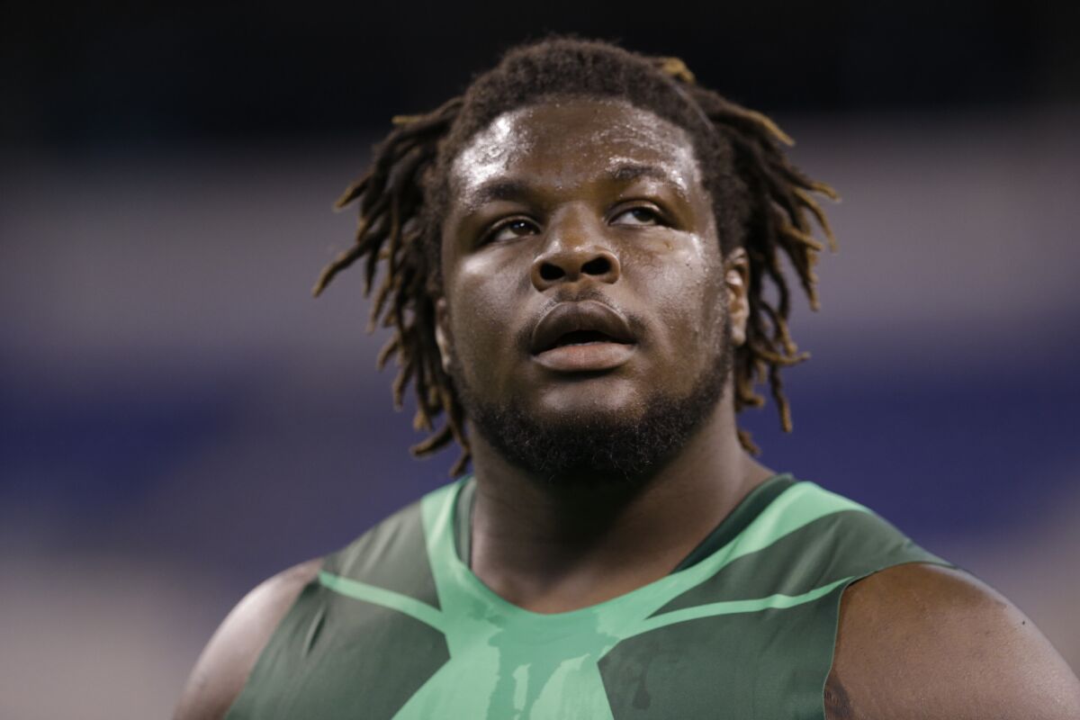 Texas defensive lineman Malcom Brown warms up for the 40-yard dash at the NFL scouting combine in Indianapolis on Feb. 22.