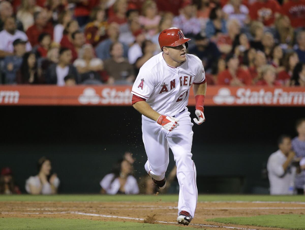 Mike Trout looks on after hitting a sacrifice fly in the third inning of the Angels' 4-2 loss to the Boston Red Sox. Trout was 0 for 3 on the night with one strikeout.