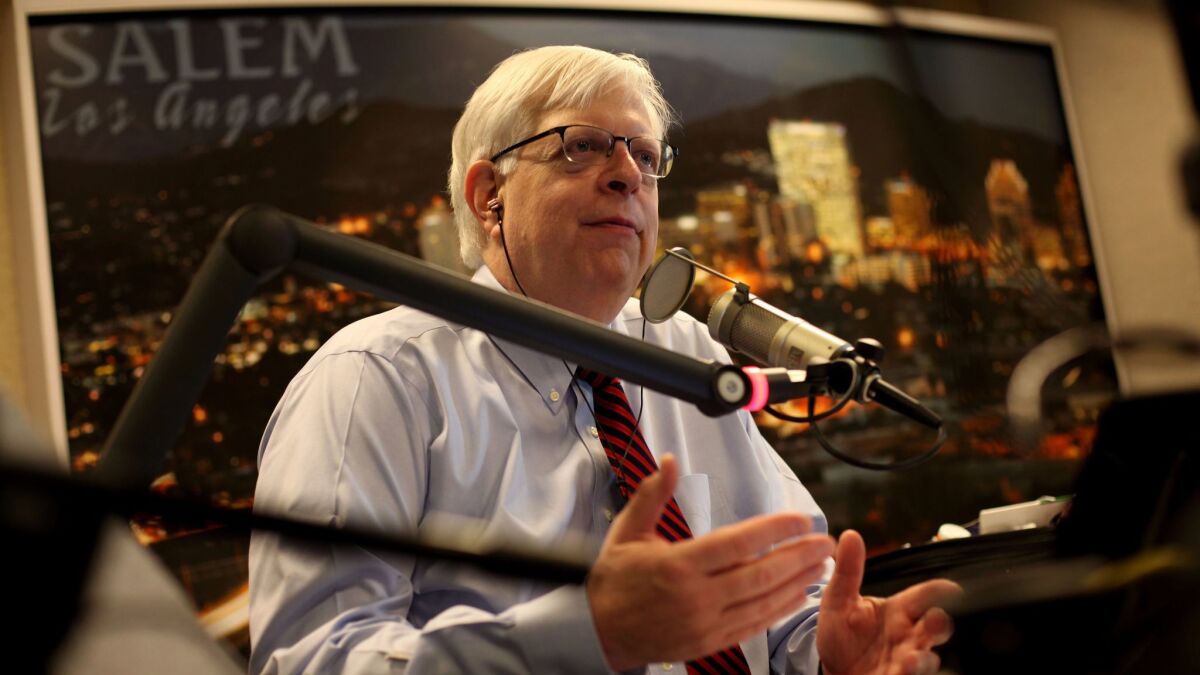 Conservative radio host Dennis Prager, seen here in the KRLA studio in Glendale in 2013, has triggered a controversy by taking a conducting gig with the Santa Monica Symphony Orchestra.