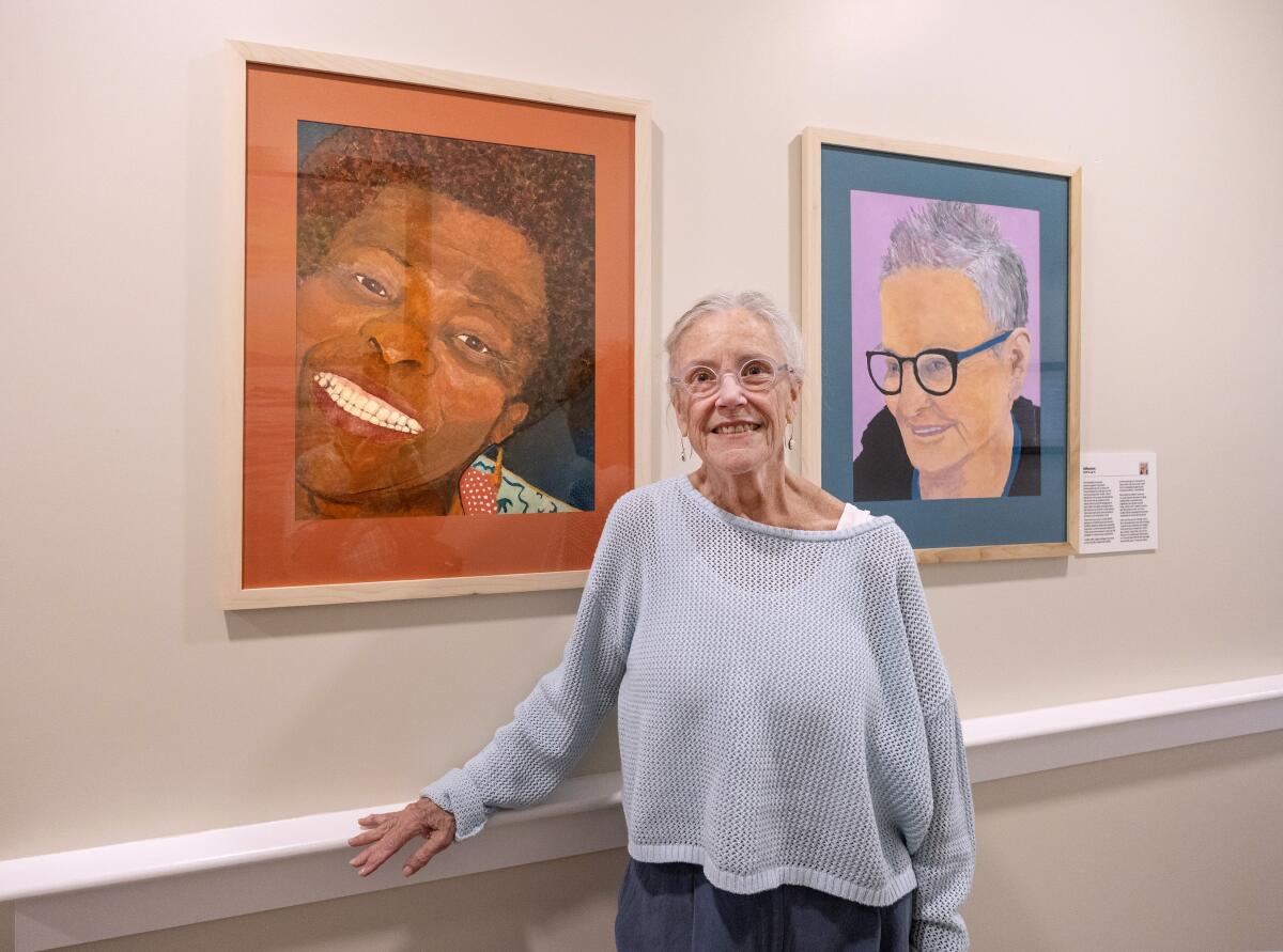 Artist Kathleen Cosgrove poses at the "Feeling Our Age" exhibit at the Watermark Laguna Niguel retirement community.