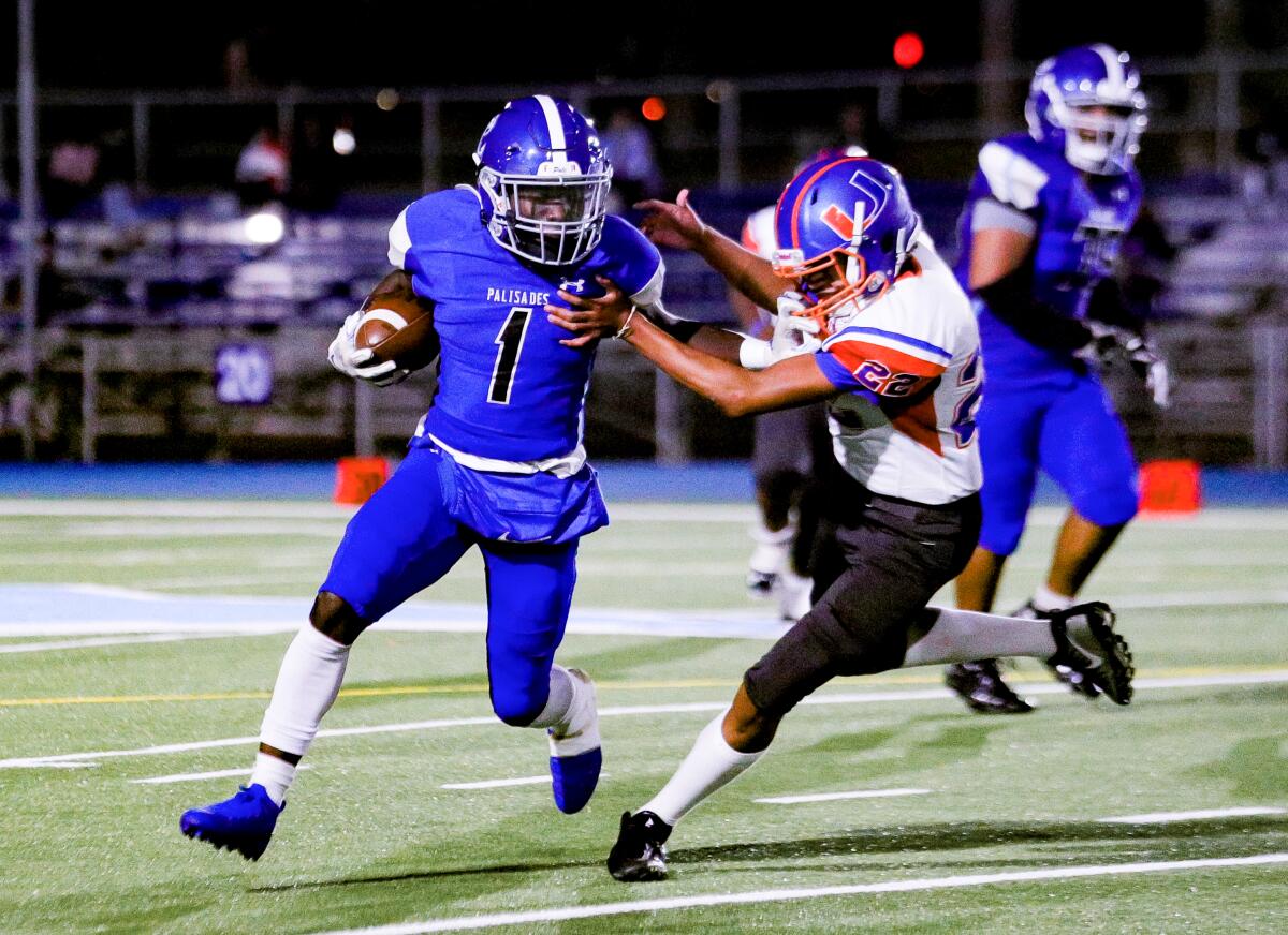 Daniel Anoh of Palisades rushes against University.