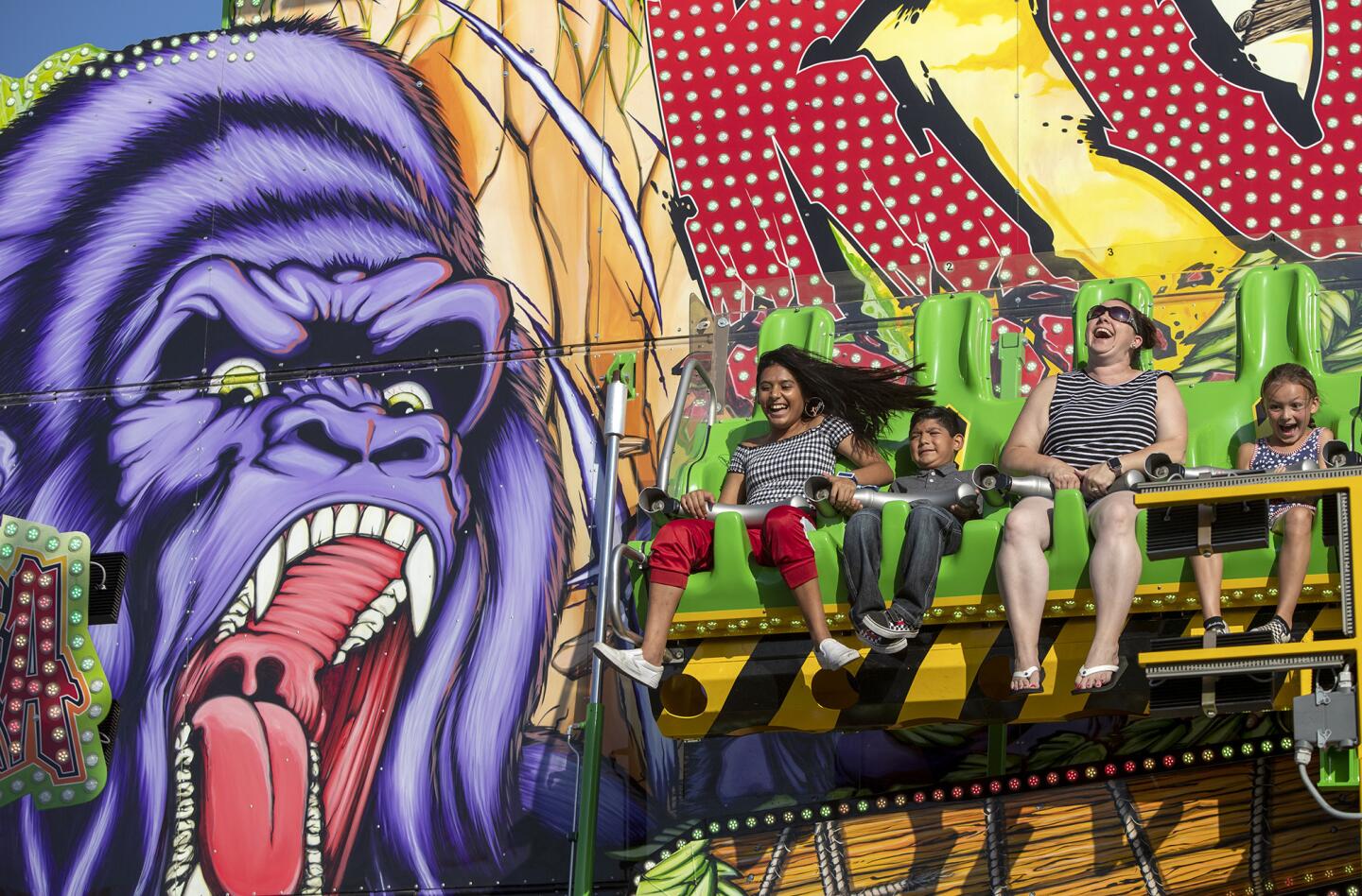 Visitors ride the new Konga attraction at the Orange County Fair.
