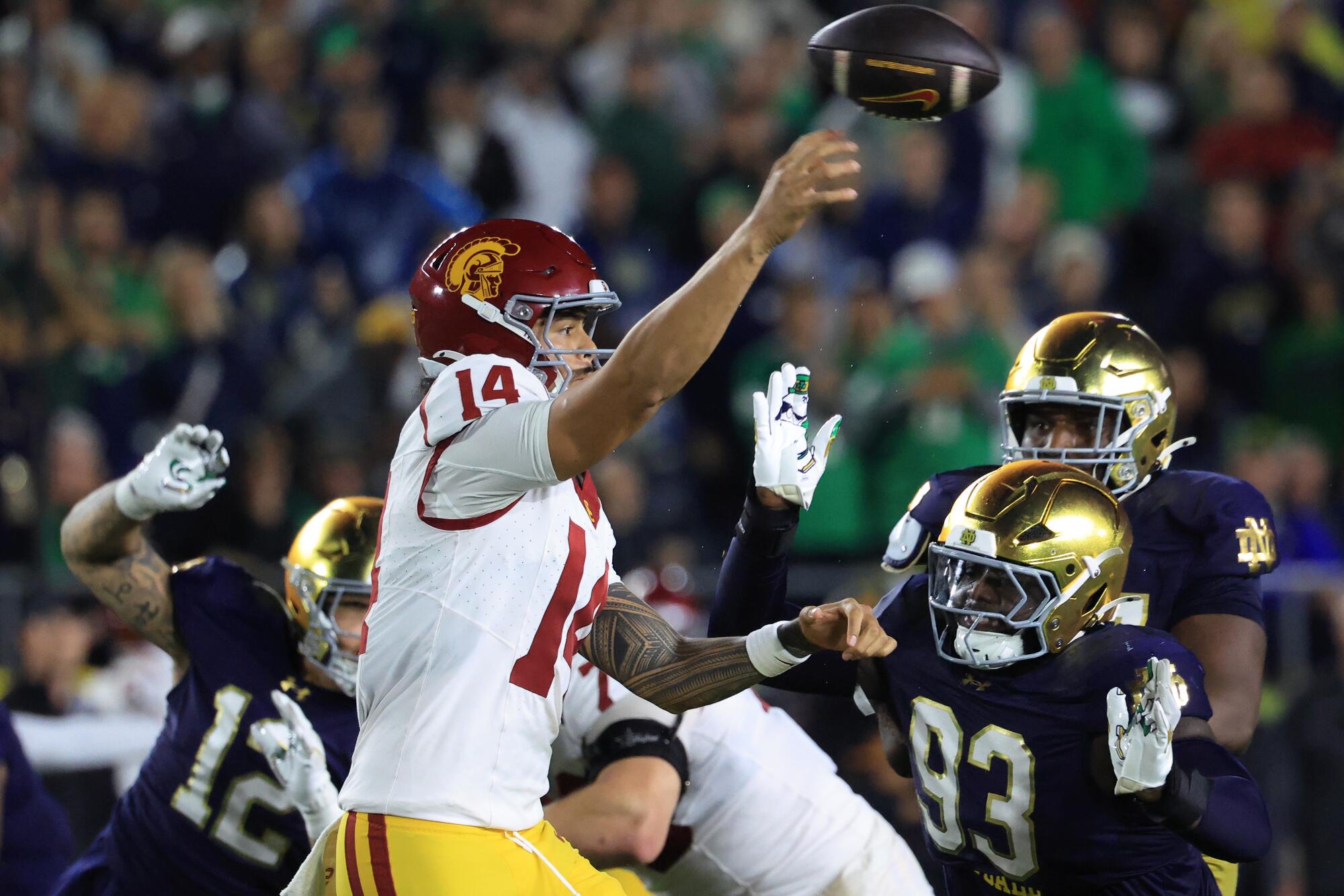 Commentary: Do not kill school soccer's finest custom. Compromise to maintain USC vs. Notre Dame 1 USC quarterback Jayden Maiava throws a pass under pressure from Notre Dame's defense on Oct. 18 in South Bend, Ind.