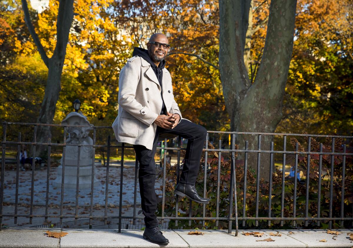 Actor Forest Whitaker leans on a park railing for a portrait.
