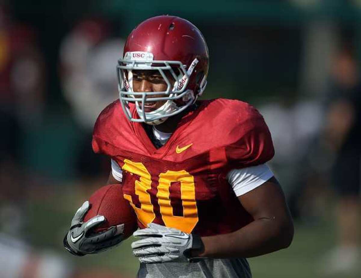 USC tailback D.J. Morgan runs with the ball during practice on Aug. 17.