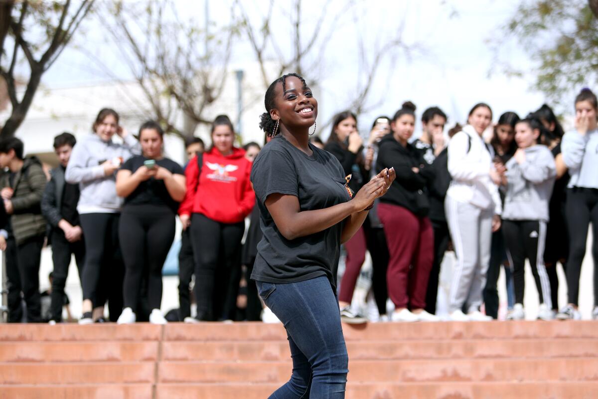 Hoover High School Black Student Union president Katrina Manor, a senior, has a good time during the Black History Month Celebration.