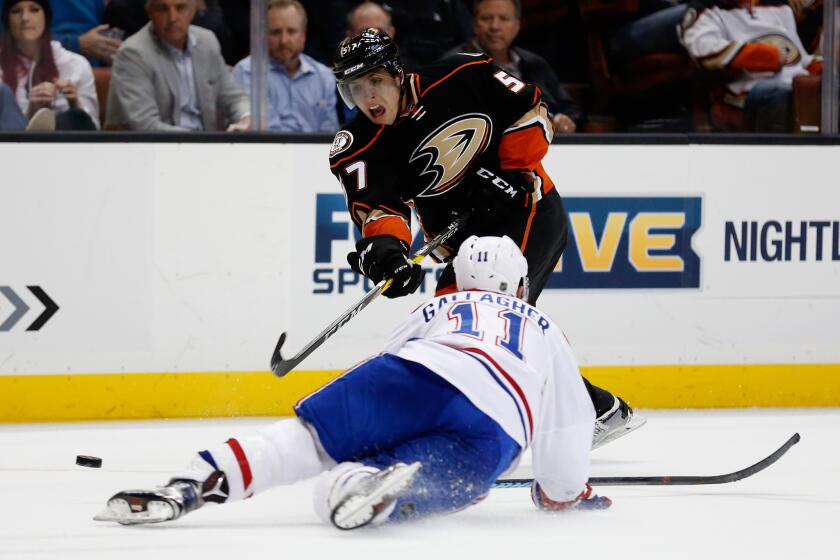 The Ducks' David Perron shoots the puck past Montreal's Brendan Gallagher on March 2.