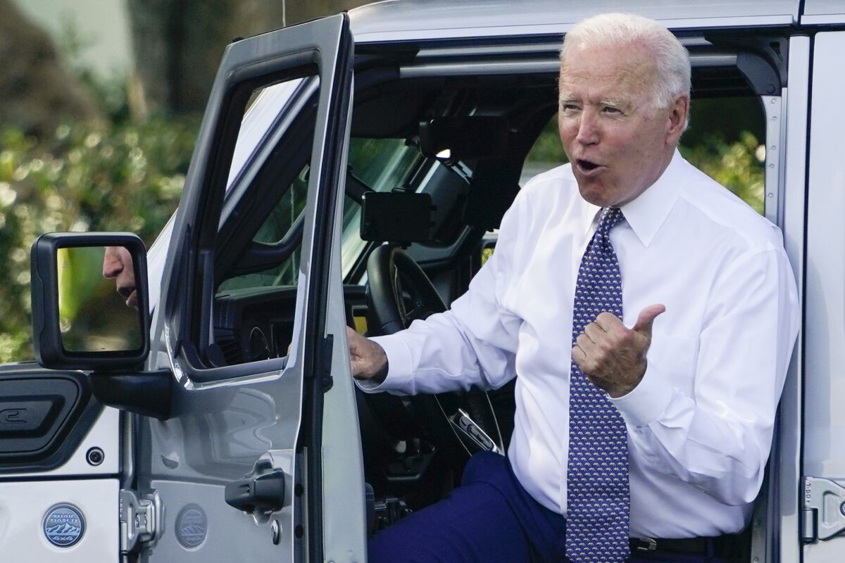 President Biden steps out of a Jeep Wrangler on the South Lawn of the White House