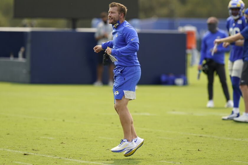 Los Angeles Rams head coach Sean McVay jumps in the middle of the field during an NFL football camp practice Tuesday, Aug. 18, 2020, in Thousand Oaks, Calif. (AP Photo/Marcio Jose Sanchez)