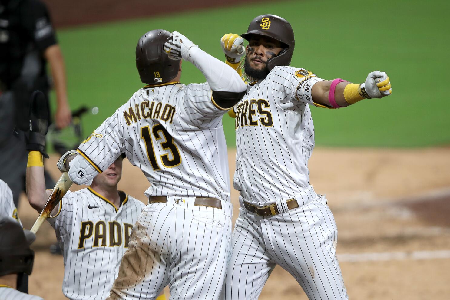 Download Fernando Tatis Jr. and Manny Machado in San Diego Padres uniforms  Wallpaper