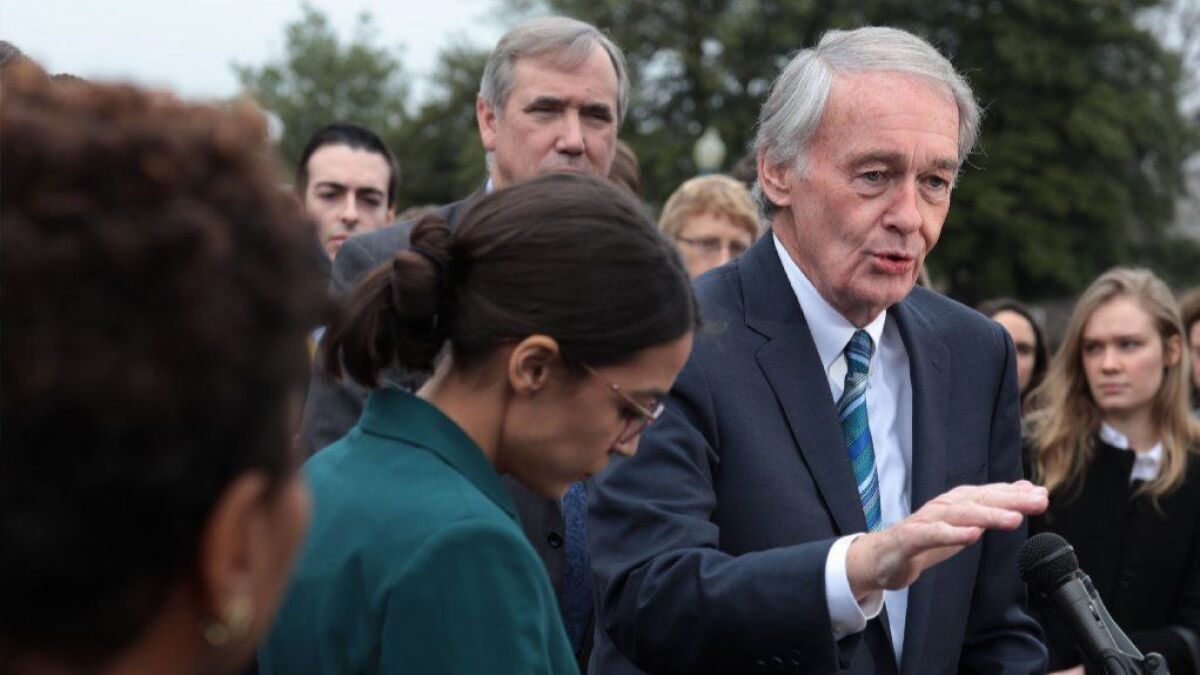 Sen. Ed Markey (D-Mass.) speaks about the Green New Deal as Rep. Alexandria Ocasio-Cortez (D-N.Y.) and other members of Congress listen during a news conference in Washington on Feb. 7.