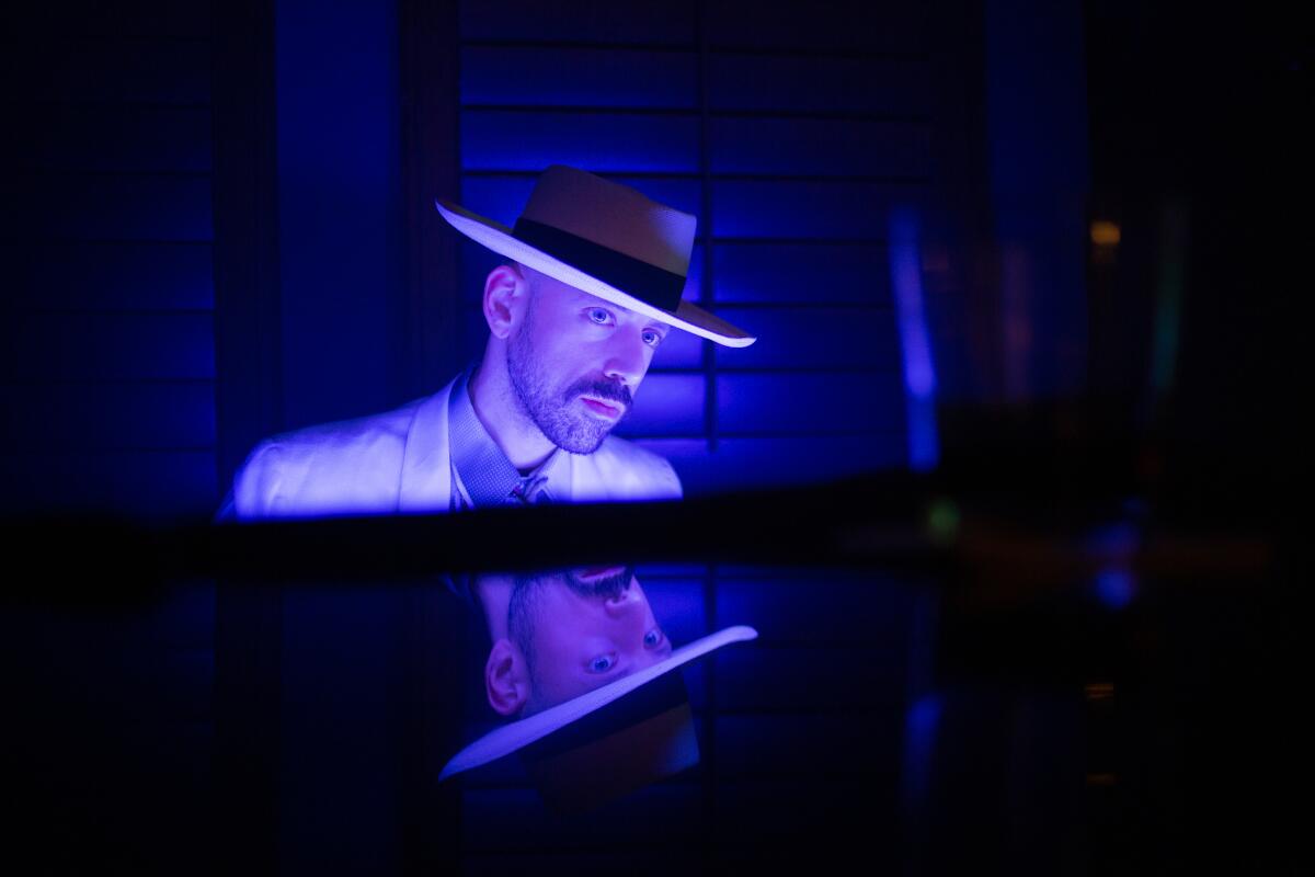 An actor in a broad-rimmed hat in a noirish scene from "Desert In."