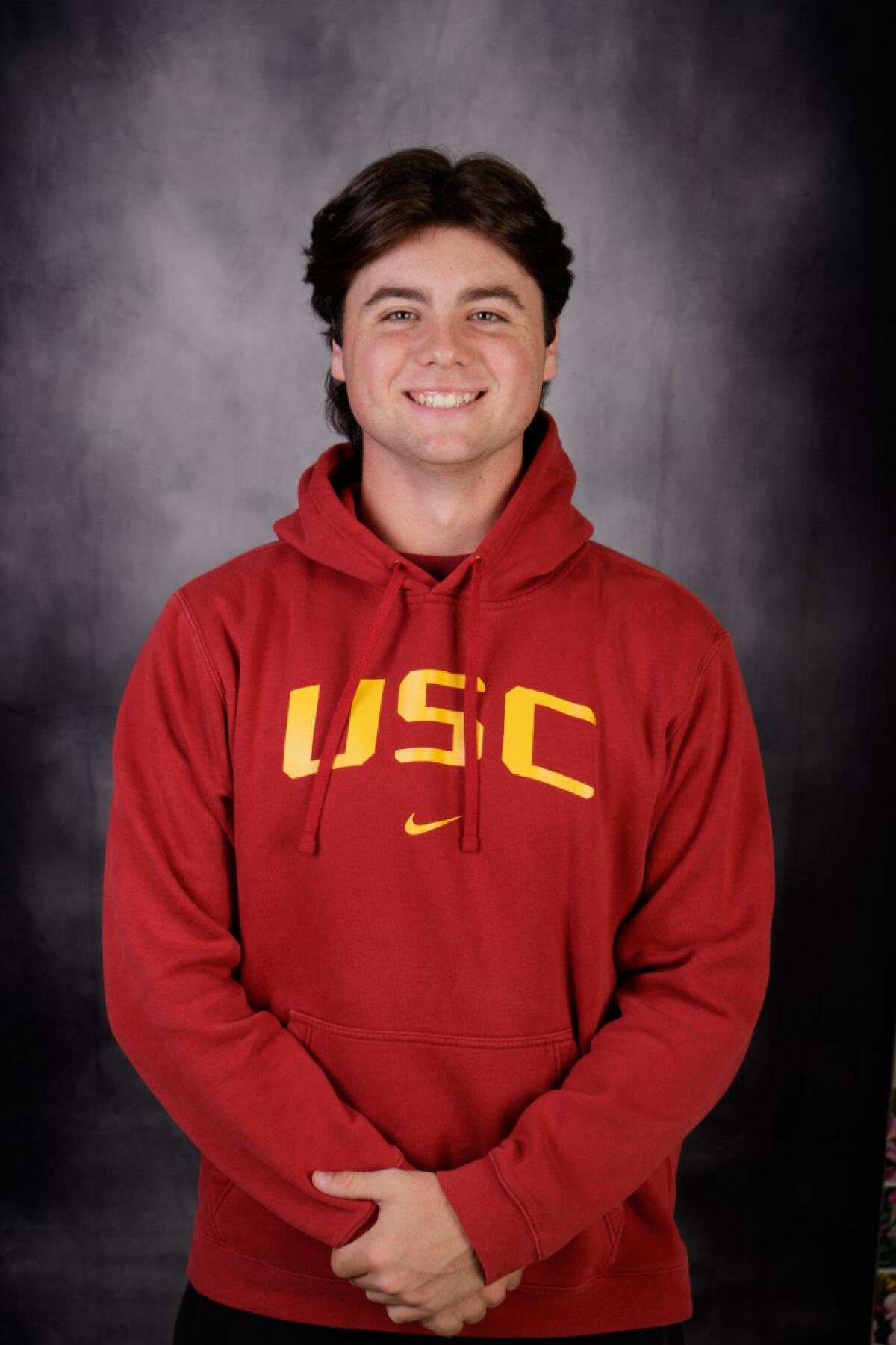Andrew Lamb of JSerra High poses in a USC sweatshirt.