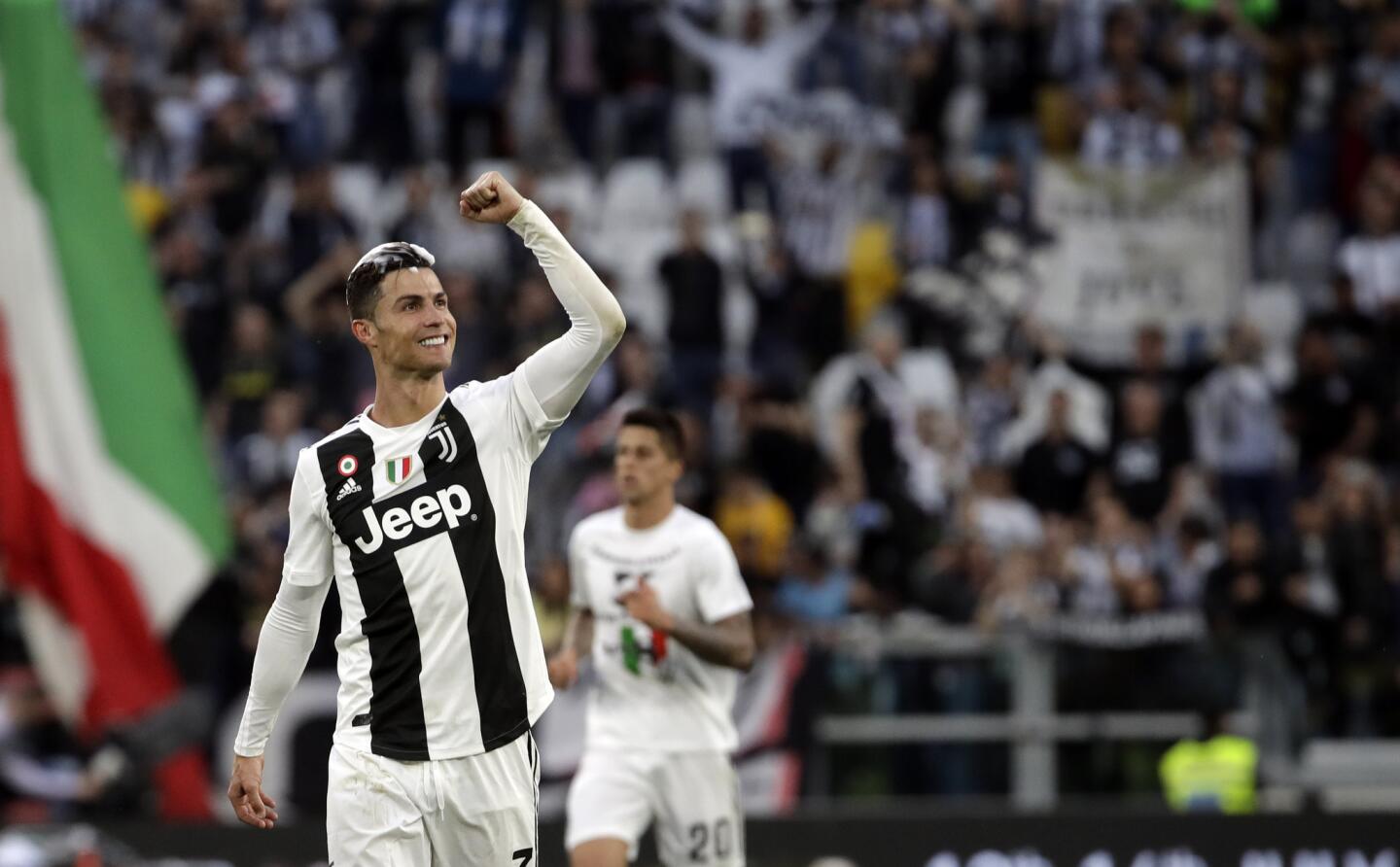 Juventus' Cristiano Ronaldo celebrates at the end of a Serie A soccer match between Juventus and AC Fiorentina, at the Allianz stadium in Turin, Italy, Saturday, April 20, 2019. Juventus clinched a record-extending eighth successive Serie A title, with five matches to spare, after it defeated Fiorentina 2-1. (AP Photo/Luca Bruno)
