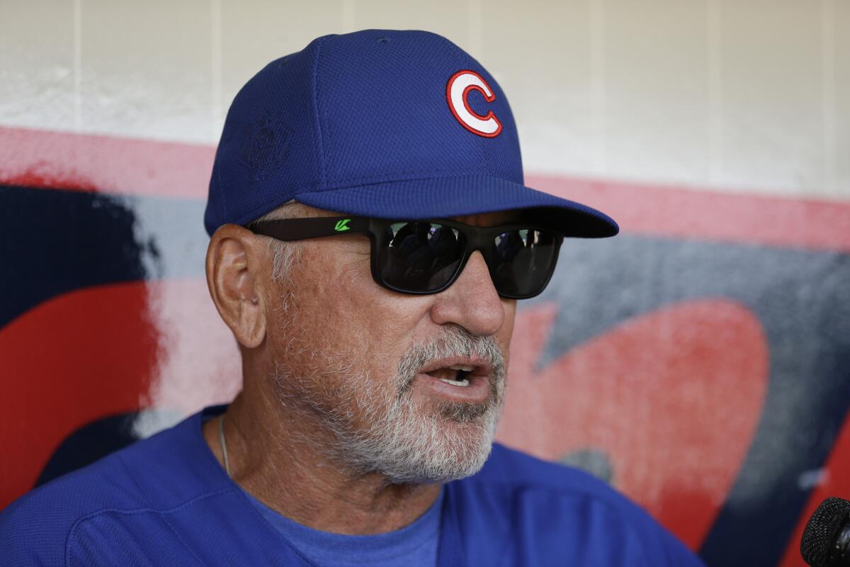 Cubs Manager Joe Maddon talks to reporters before a spring training game on March 22.