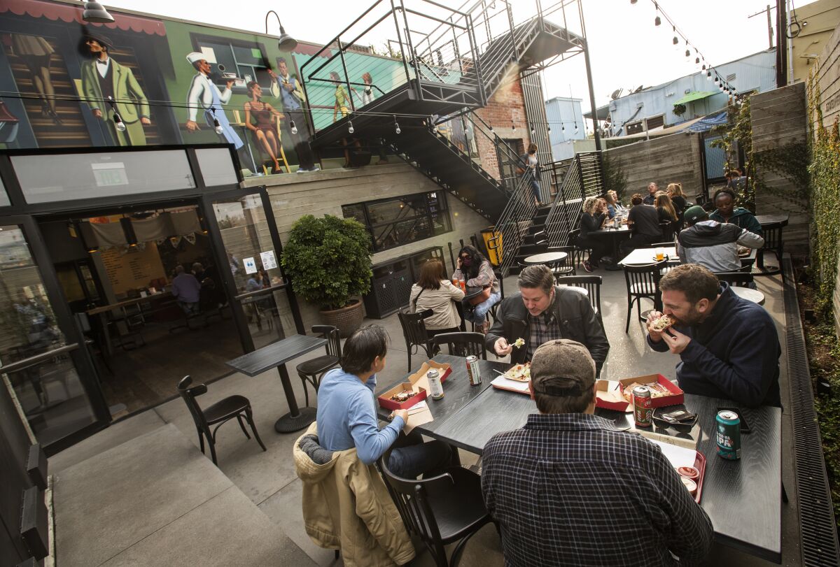 Customers dine in the back patio at Citizen Public Market in Culver City.