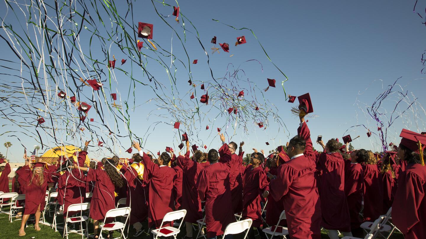 Graduates celebrate as confetti and streamers fall during the conclusion of Ocean View High School's Class of 2017 graduation ceremony in Huntington Beach on Wednesday. (Kevin Chang/ Daily Pilot)