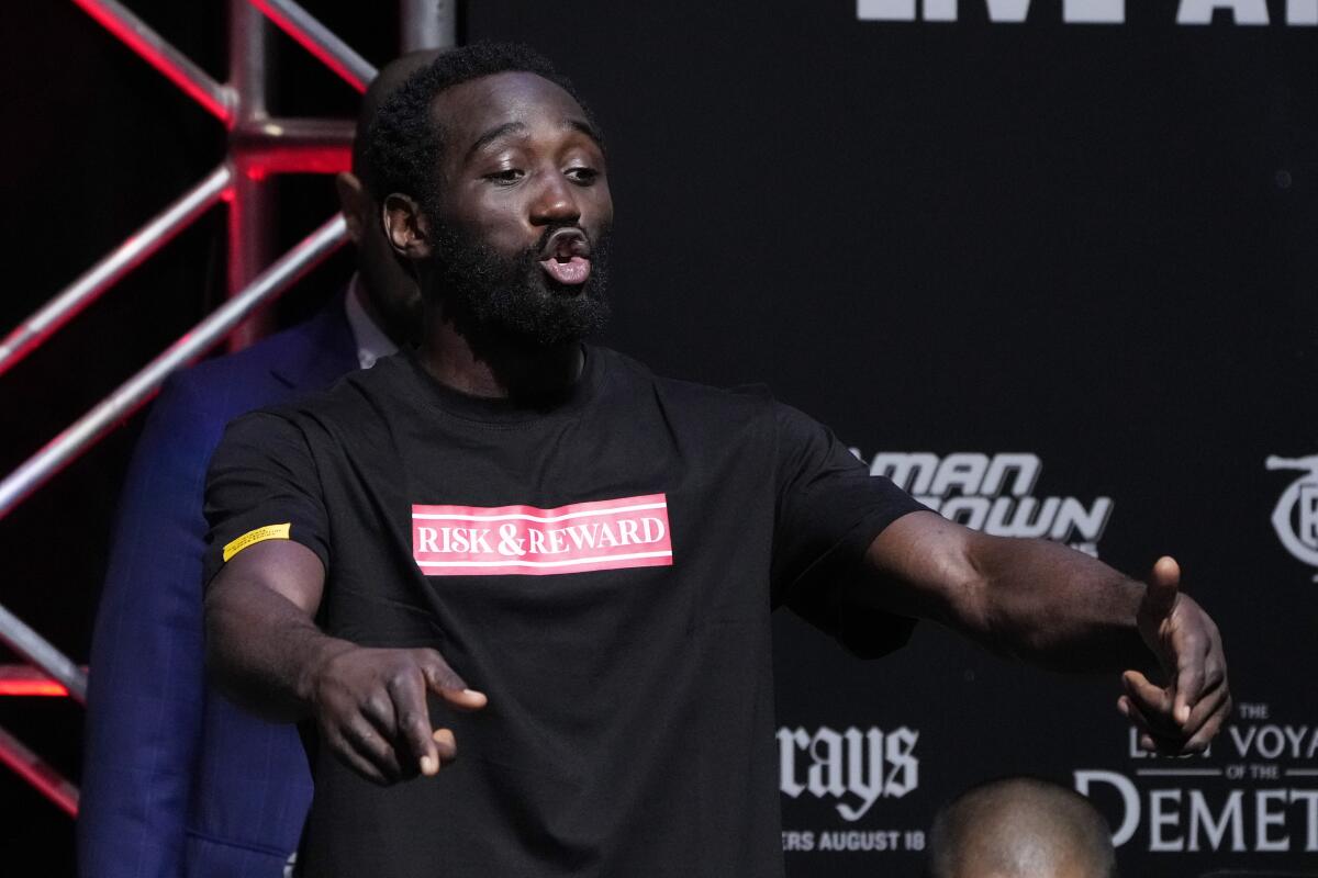 Terence Crawford reacts during a weigh-in Friday in Las Vegas ahead of his fight with Errol Spence Jr.