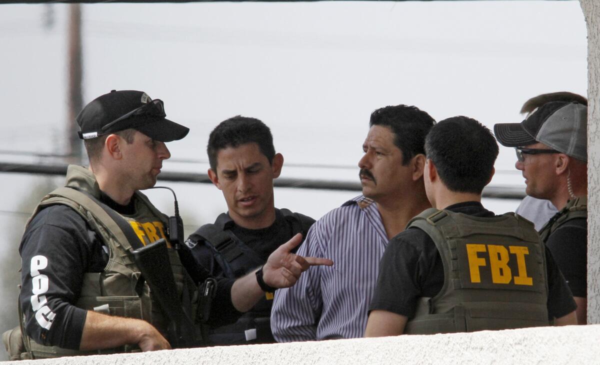 Cudahy Councilman Osvaldo Conde surrenders to FBI after a long standoff at his business on June 22, 2012.