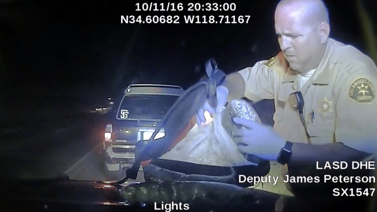 Frame grab from dash cam video presented as evidence in a court case of Los Angeles County Sheriff's Deputy James Peterson during a traffic stop on Oct. 11, 2016, where drugs where found. A judge recently threw out the guns and drugs Peterson found after a traffic stop, deciding a video showed no legal grounds for his traffic stop.