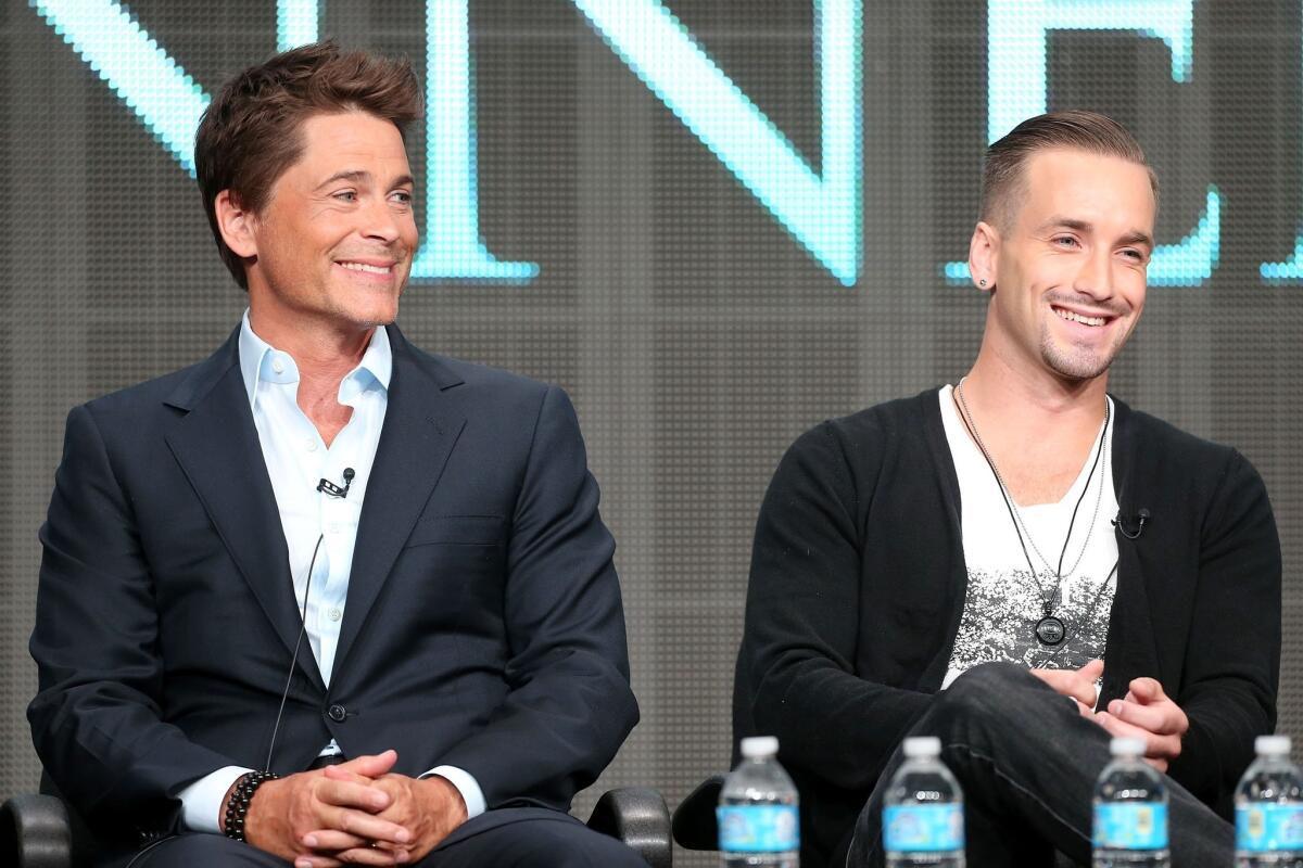 Rob Lowe, left, and Will Rothhaar discuss "Killing Kennedy" Wednesday during the TCA press tour in Beverly Hills. Lowe plays John F. Kennedy and Rothhaar costars as Lee Harvey Oswald in the National Geographic TV film, set to air November.