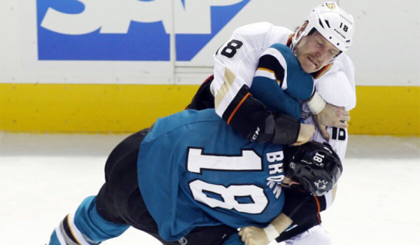The Ducks' Tim Jackman, top, fights with San Jose's Mike Brown.