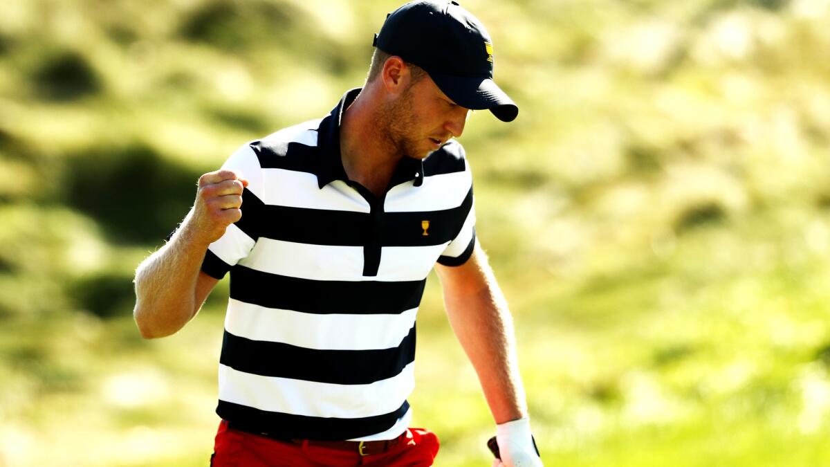 Daniel Berger reacts after making a putt at No. 11 during his match Sunday at the Presidents Cup.