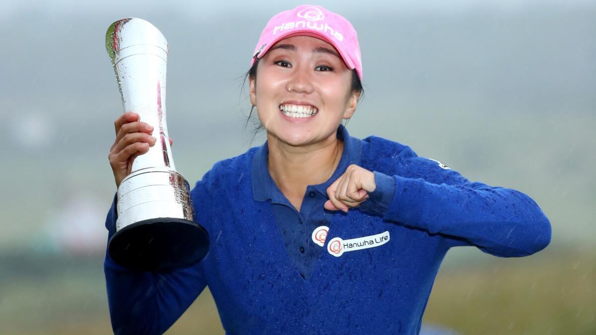 I.K. Kim celebrates after receiving the winner's trophy at the Women's British Open on Sunday.