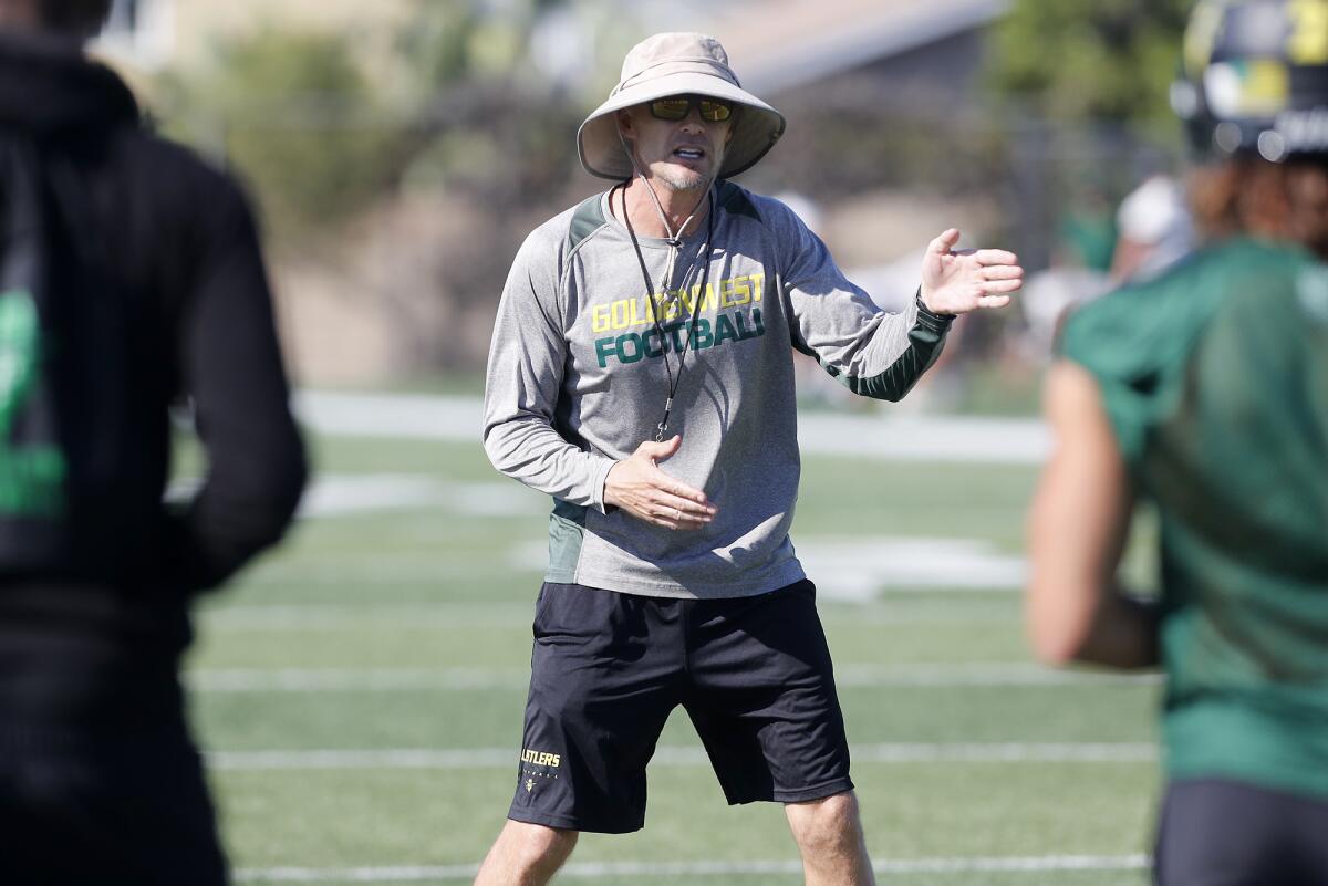 Golden West College coach Nick Mitchell, pictured instructing his players on Friday in Huntington Beach, is in his 14th year in charge of the Rustlers.
