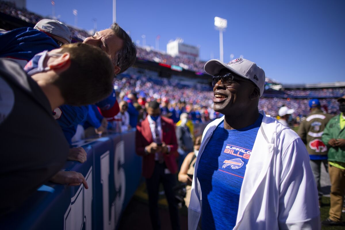 Bruce Smith speaks with Bills fans before a game.