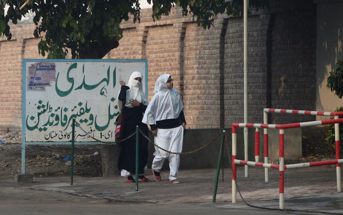 Pakistani students arrive at Al-Huda Institute in Multan on December 7, 2015, where female US shooter Tashfeen Malik studied.