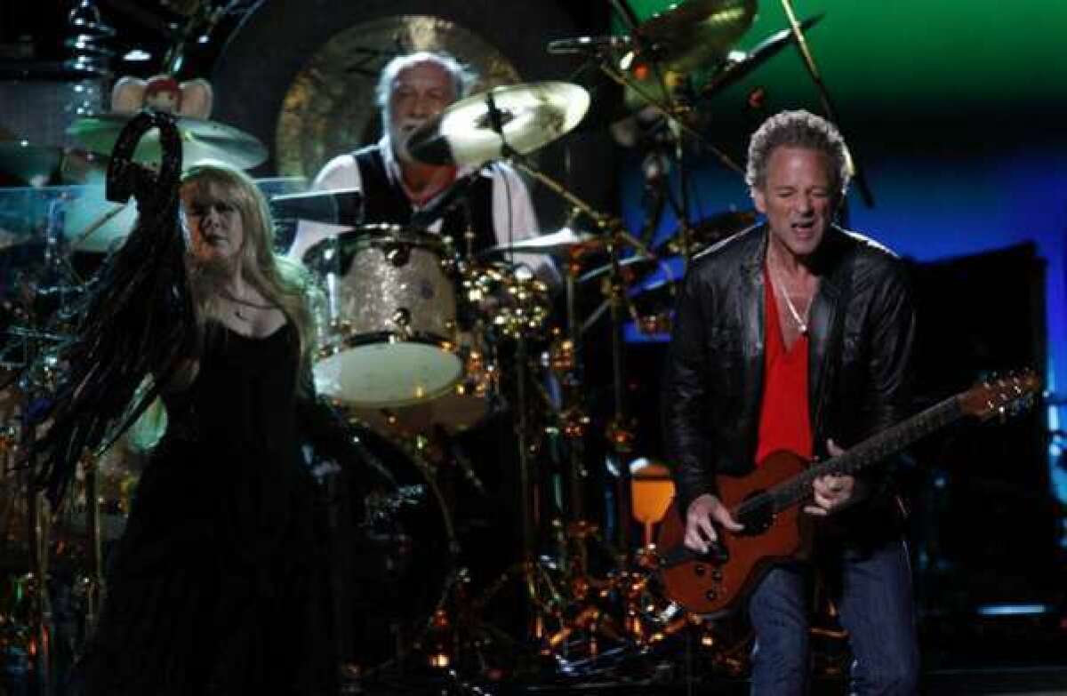 Stevie Nicks and Lindsey Buckingham with Mick Fleetwood on drums at the Honda Center in Anaheim in 2009.