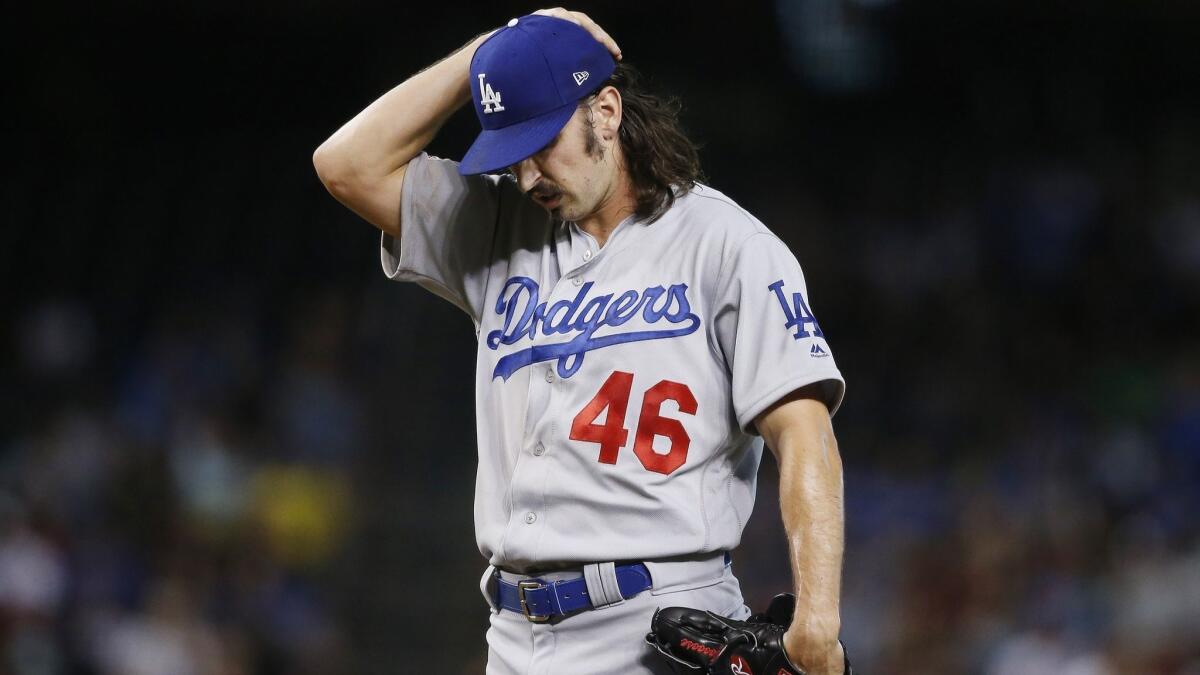 Dodgers starting pitcher Tony Gonsolin pauses on the mound during the first inning against the Arizona Diamondbacks on Wednesday in Phoenix.